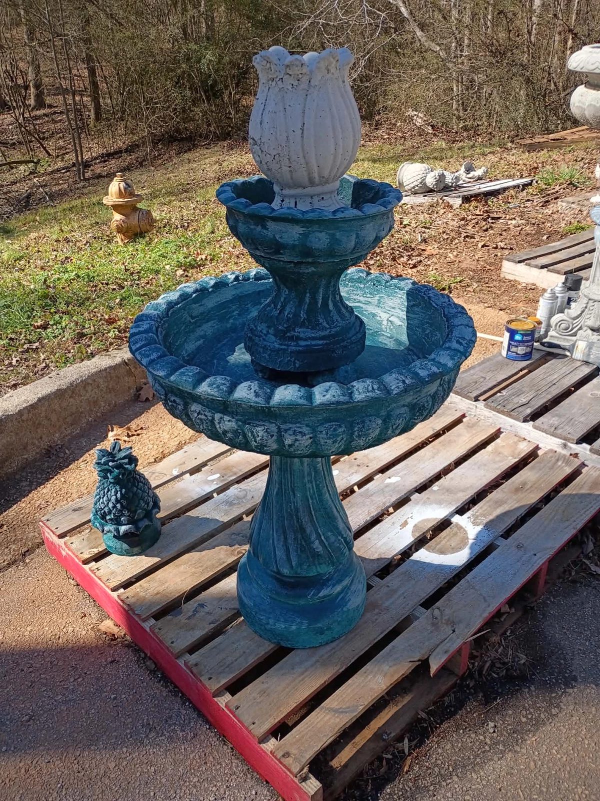White tulip topper option on a teal two-tier concrete fountain — $450