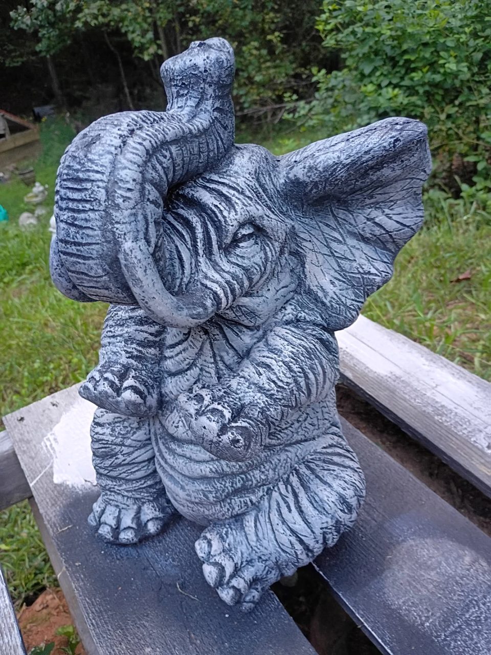 Concrete baby elephant statue with trunk raised in a charcoal antiqued finish, $65, in Villa Rica, GA