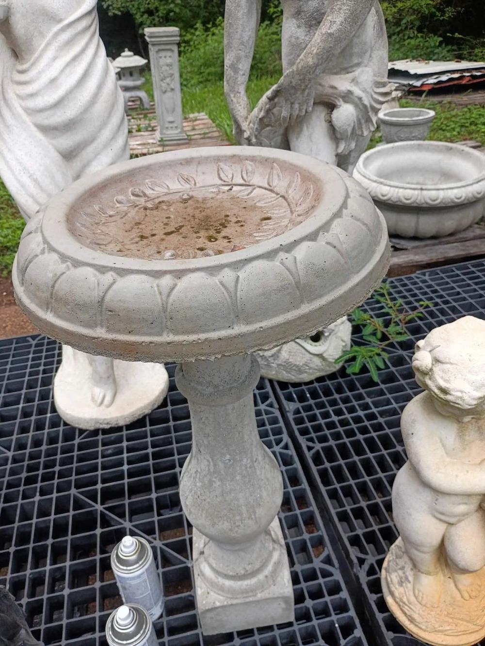 Fresh cast concrete lotus bowl bird bath on a baluster pedestal in Villa Rica, GA