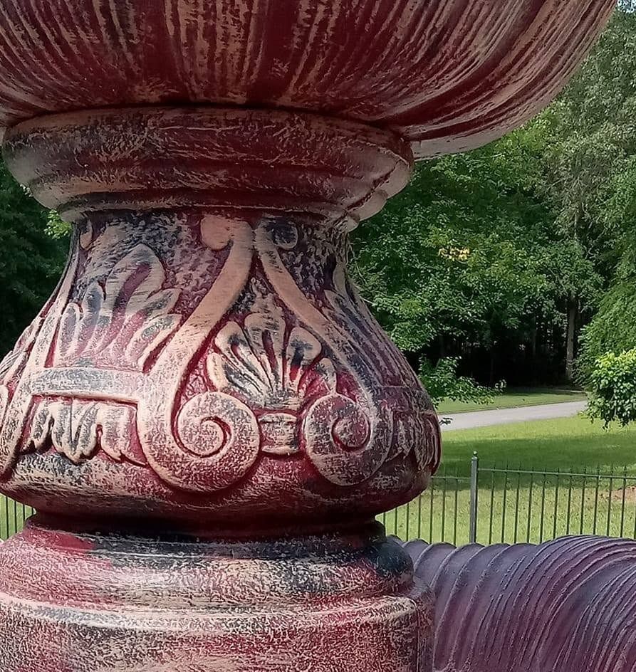 Close-up of the hand-brushed burgundy finish detail
