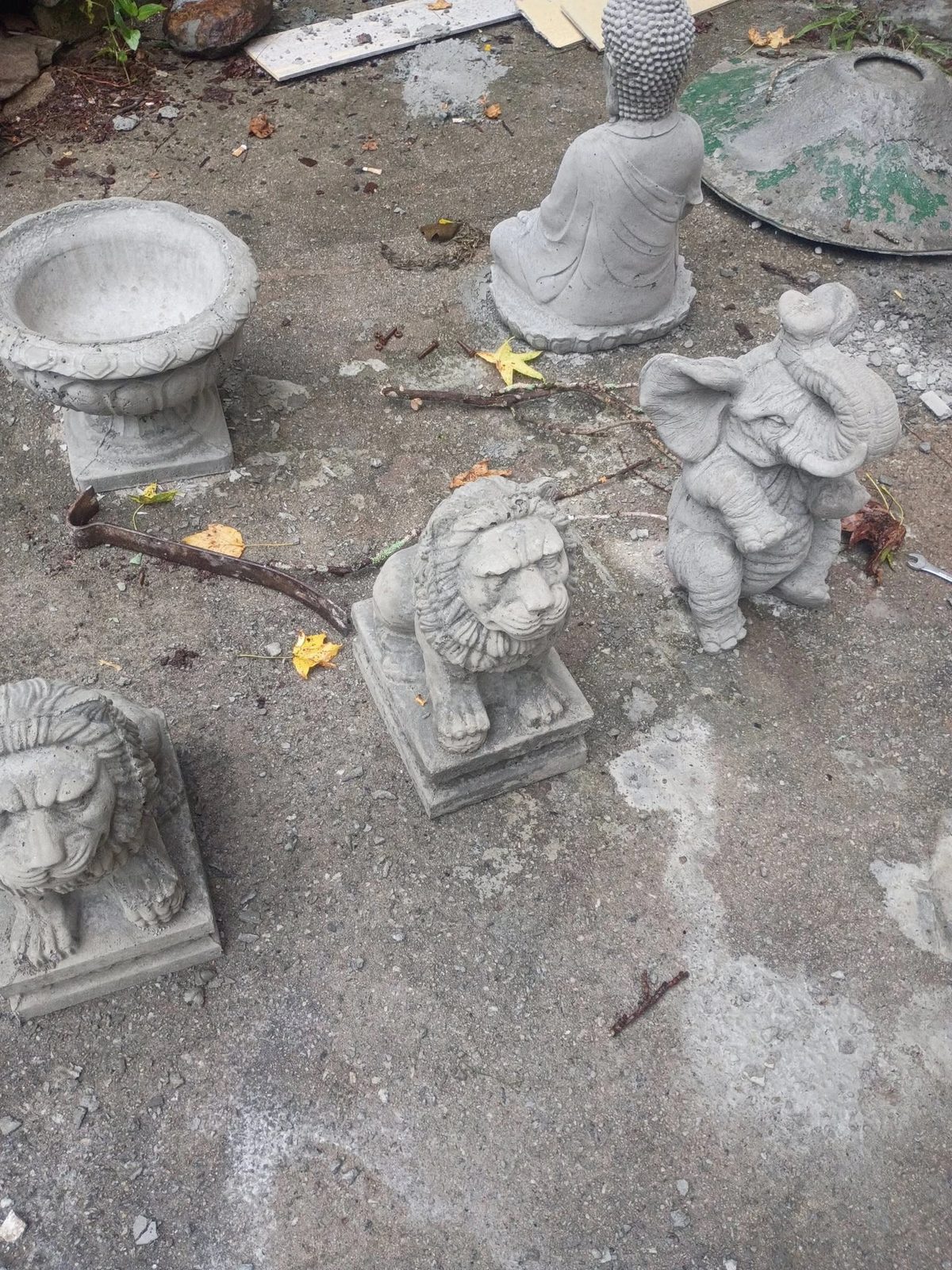 Fresh cast concrete statues and planters curing on the pad at the Villa Rica shop