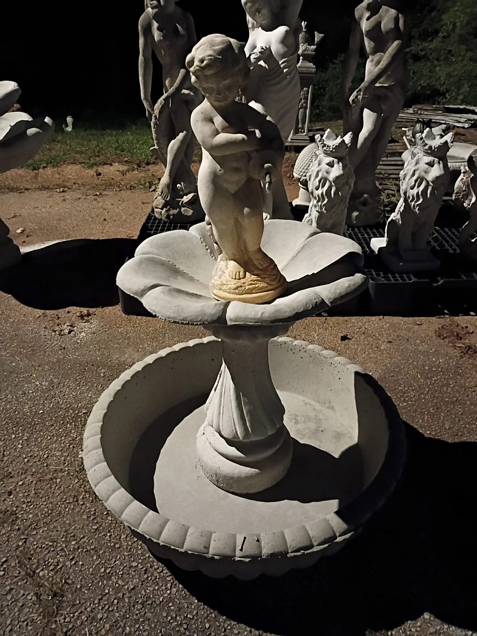 Concrete cherub fountain with petal bowl, twisted pedestal, and scalloped round basin, $975, in Villa Rica, GA