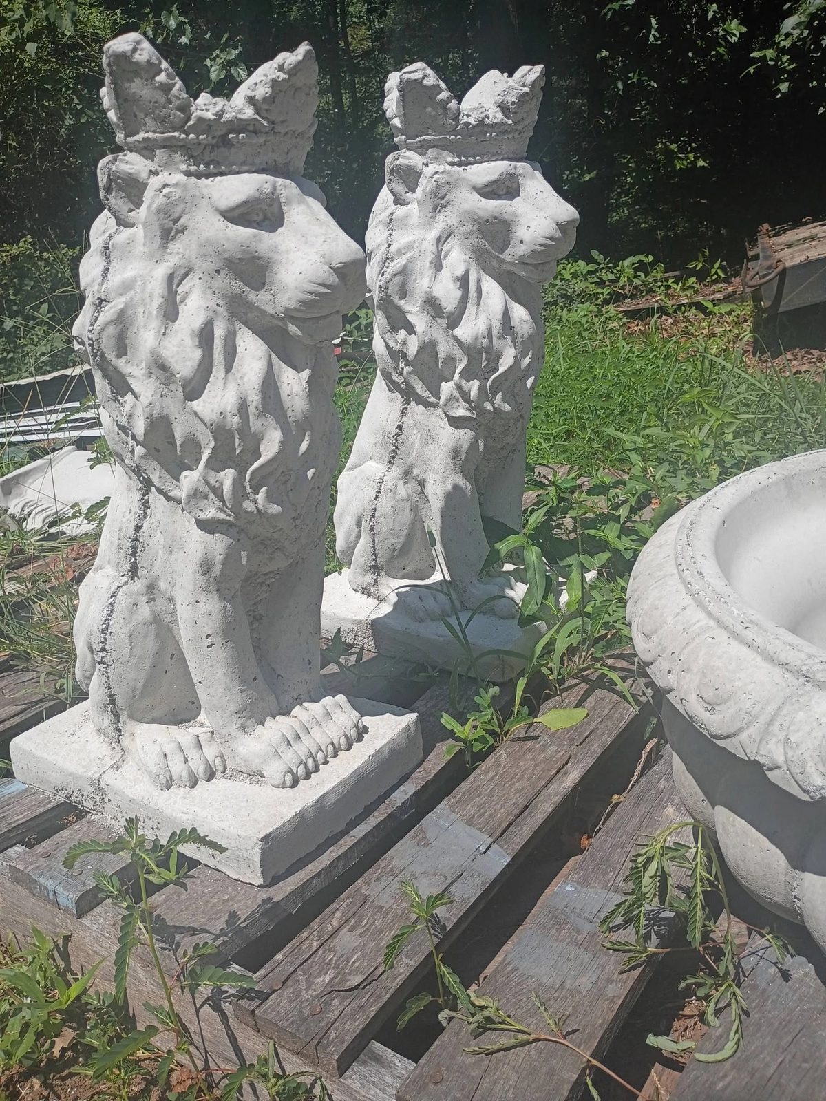 Matched pair of concrete crowned lion statues in bright white in Villa Rica, GA