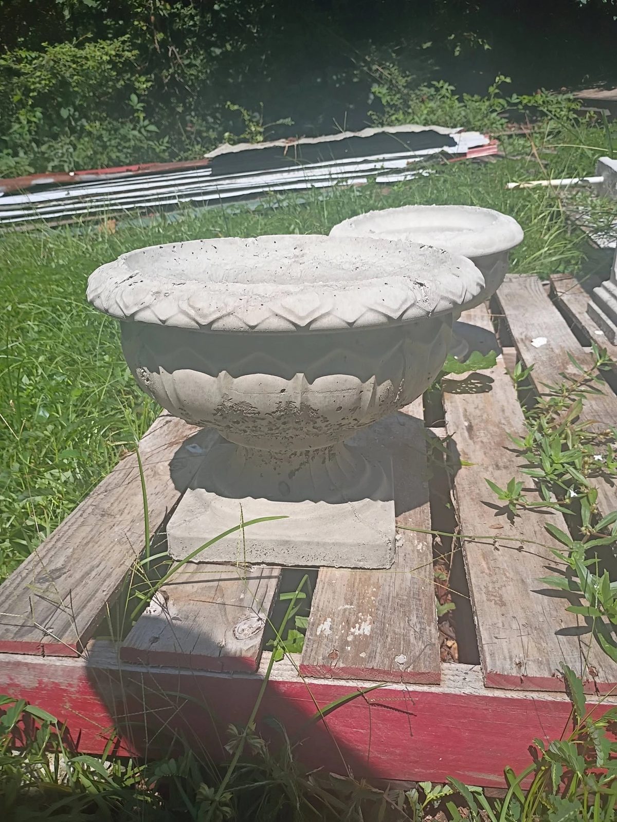 Two fresh cast concrete bowl planters with egg and dart rims in Villa Rica, GA