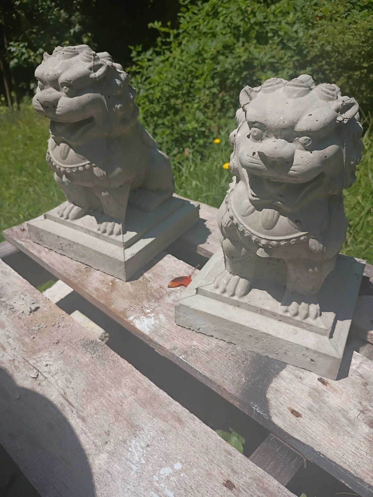 Pair of concrete foo dog guardian statues in Villa Rica, GA
