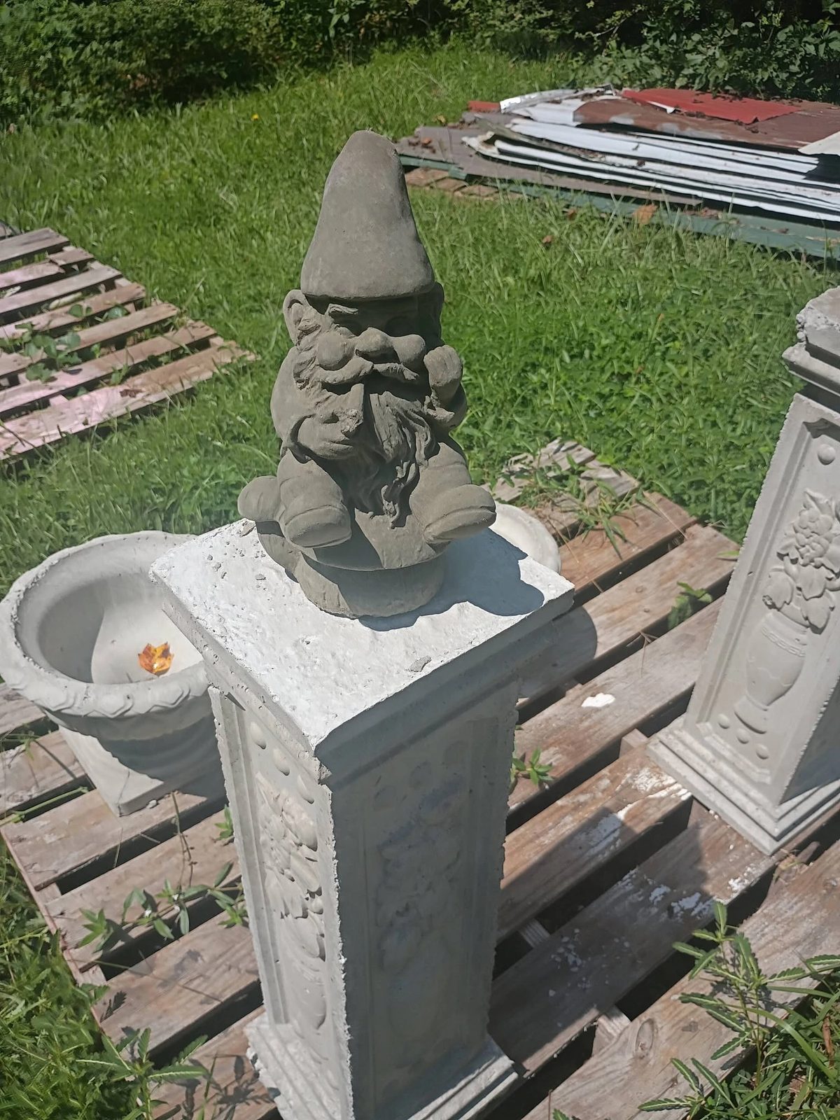 Concrete garden gnome statue on a carved pedestal, $15, in Villa Rica, GA