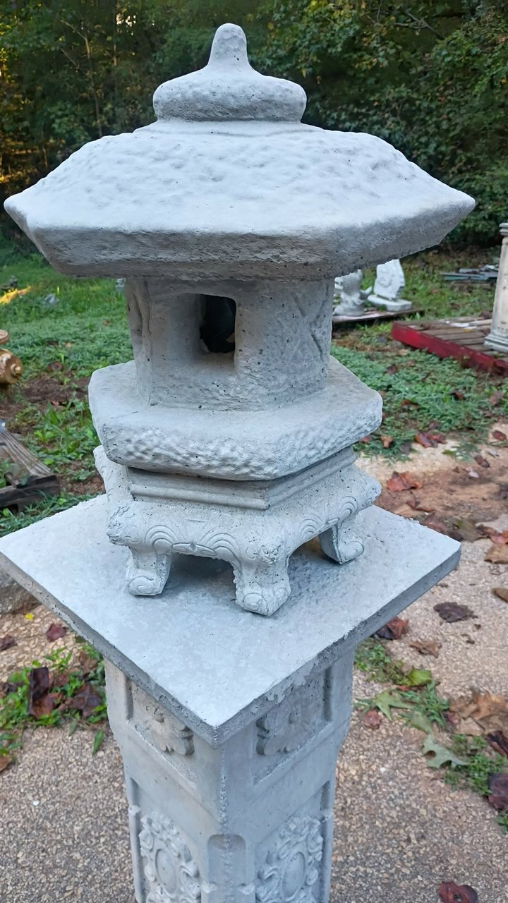 Six-sided concrete pagoda style garden lantern with finial roof on a footed base, $65, in Villa Rica, GA