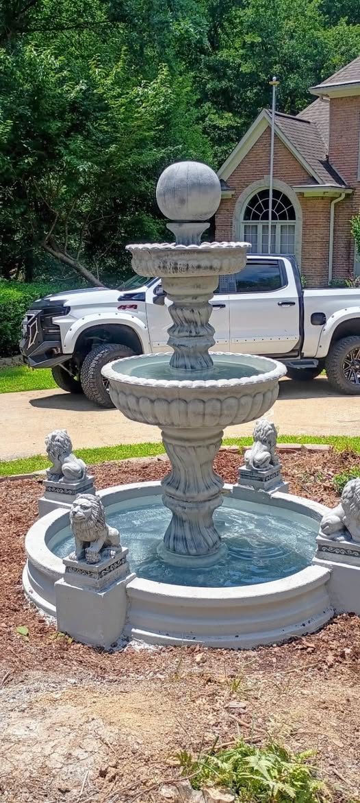 Large 3-tier stone fountain with lion guardians, installed at a Georgia driveway