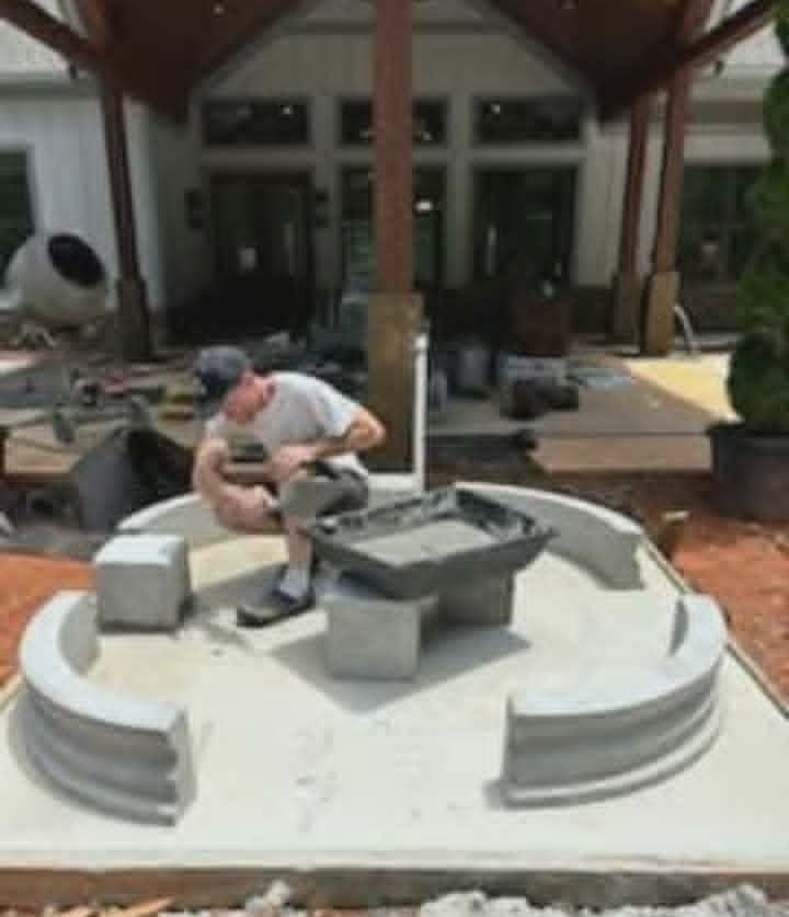 The owner assembling the base ring of The Majestic fountain on site