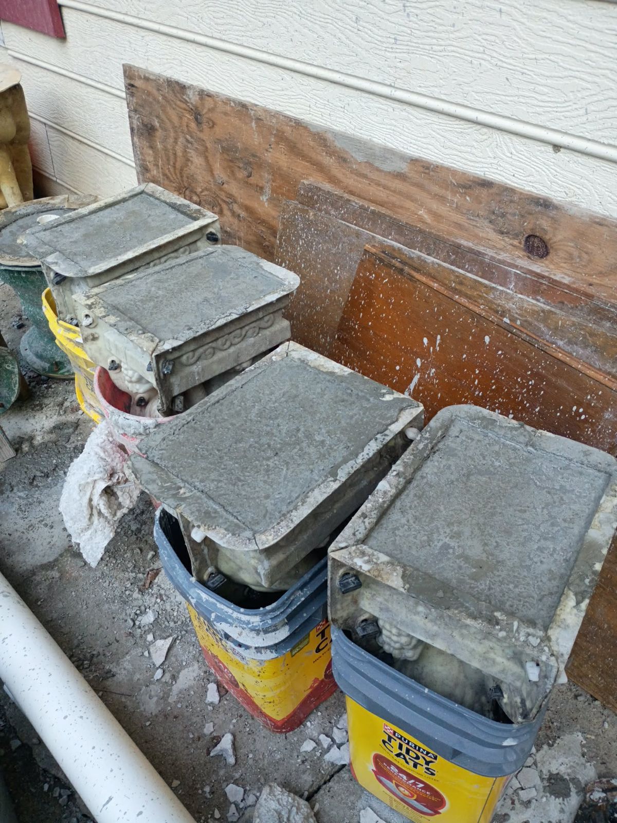 Square concrete pedestal caps for the lion blocks curing in molds