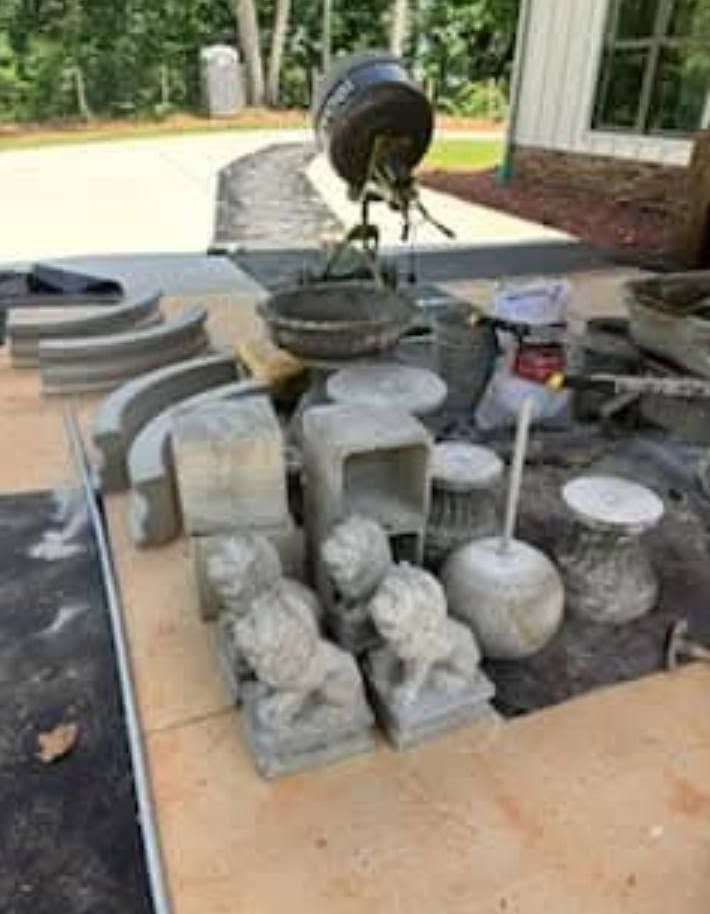 Hand-cast pieces of The Majestic fountain laid out before assembly
