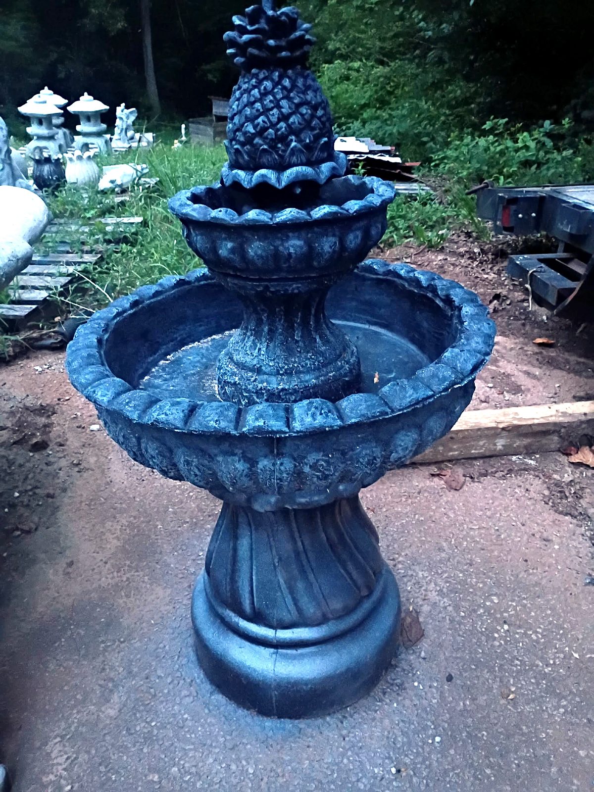 Two-tier concrete pineapple fountain in a charcoal slate finish, available in Villa Rica, GA