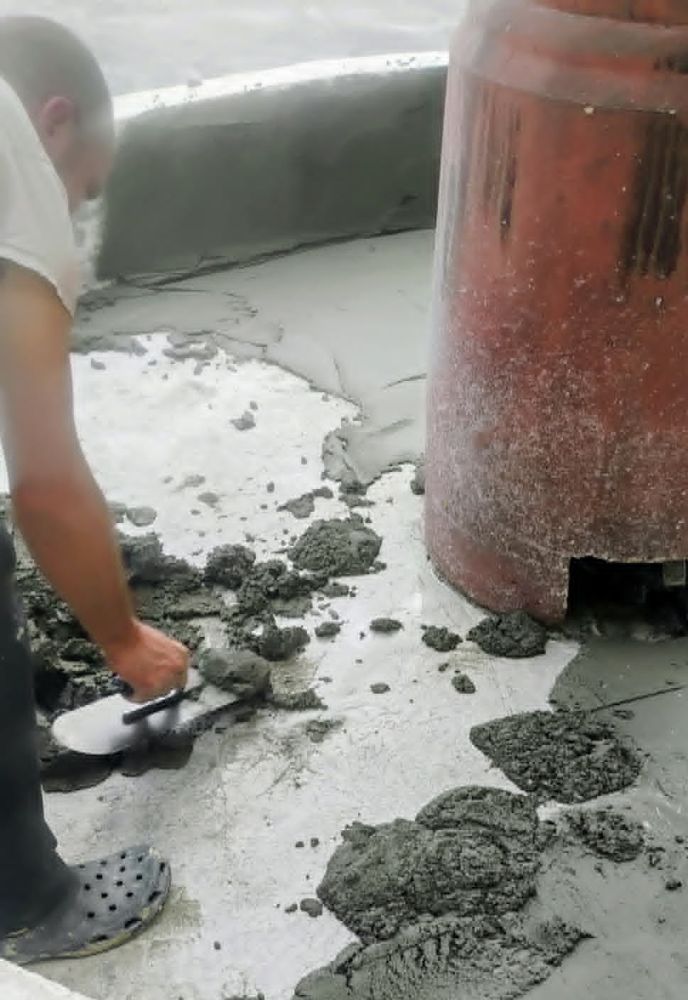 Patching and resurfacing a cracked commercial fountain basin with fresh concrete