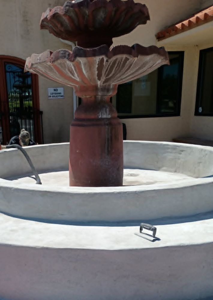 Fountain basin fully resurfaced with a fresh white coat, ready for color
