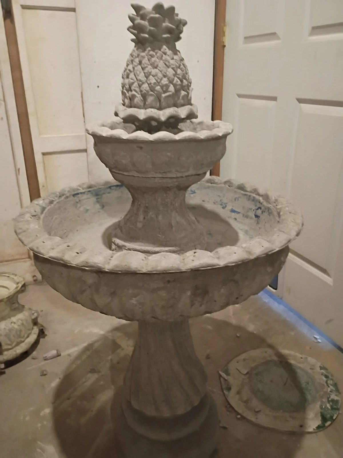 Two-tier pineapple fountain in raw concrete, fresh out of the mold at the Villa Rica shop