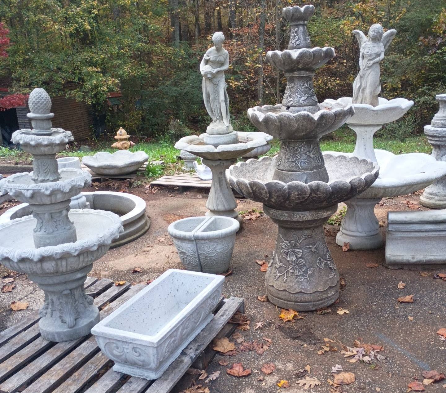 A view of fountains, statues, and pieces in the yard at Villa Rica